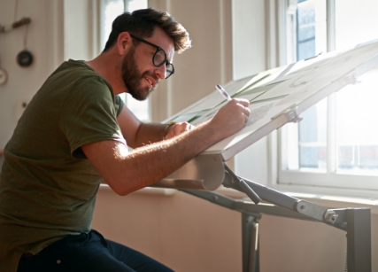 Man working at drafting table